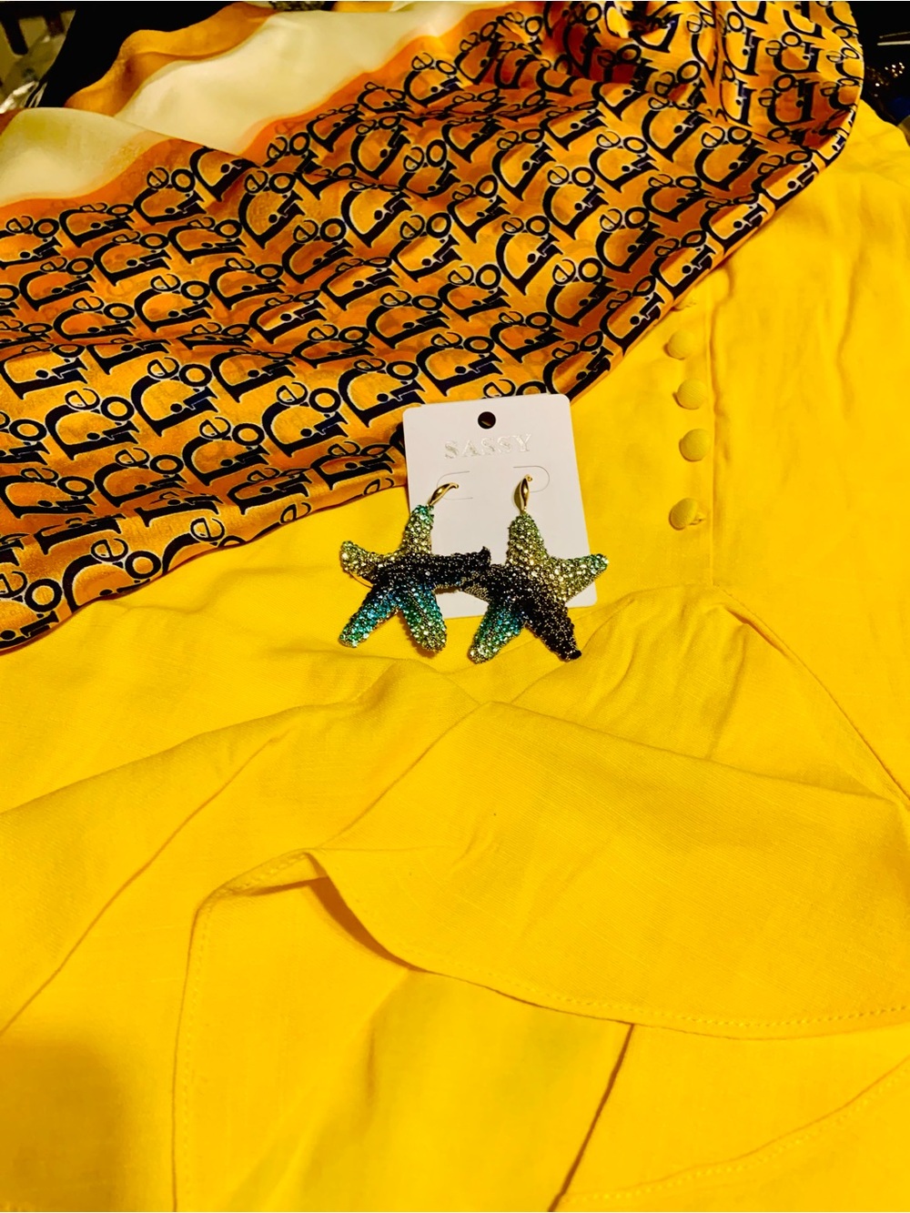 Sparkling Starfish Earrings on Bright Yellow Dress